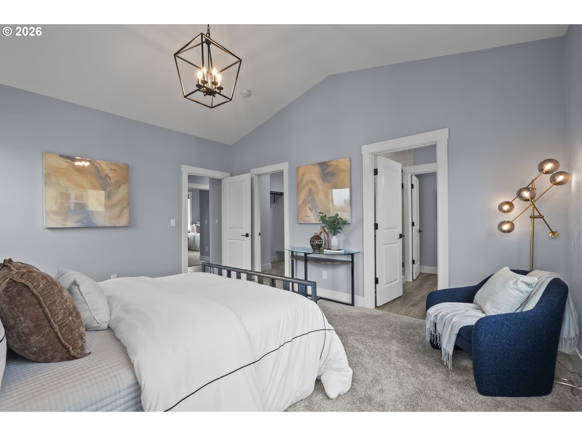 819 Riley Drive Northeast Silverton, OR 97381 - Photo 17 of 38 a bedroom with a bed and chandelier