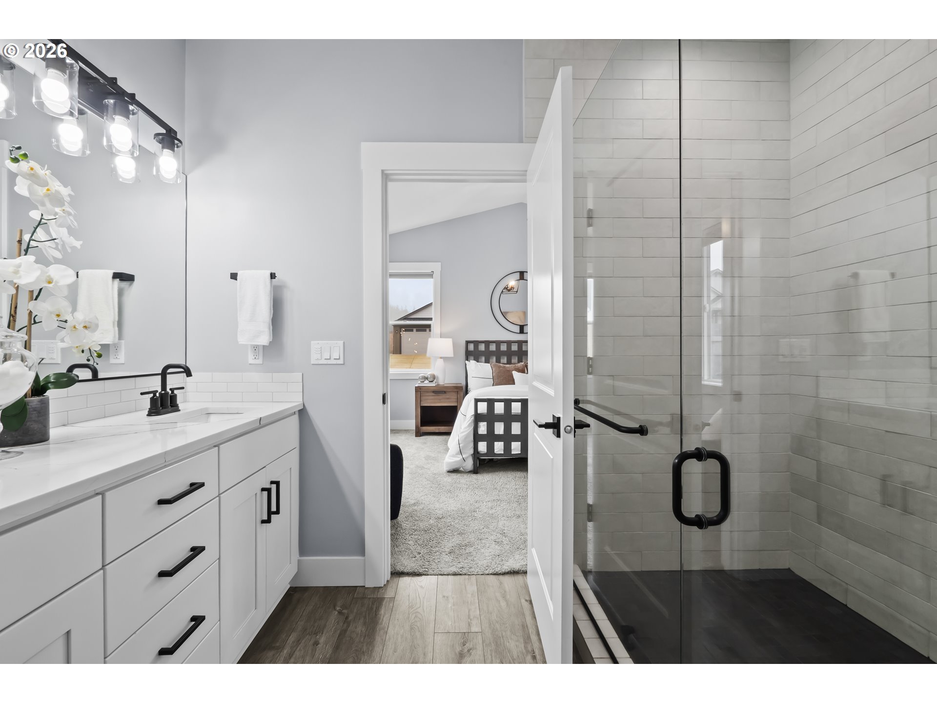 819 Riley Drive Northeast Silverton, OR 97381 - Photo 19 of 38 a en suite bathroom with a granite countertop sink mirror and shower