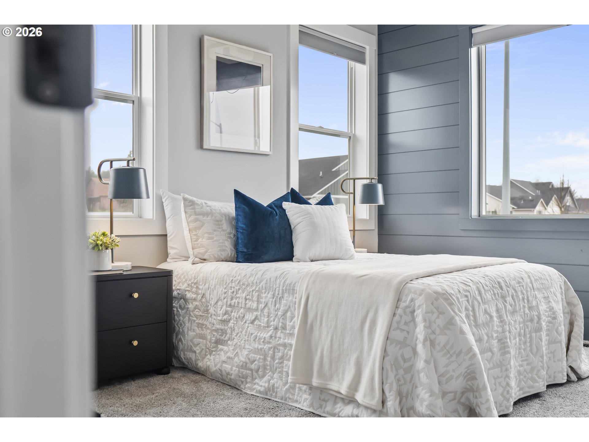 819 Riley Drive Northeast Silverton, OR 97381 - Photo 24 of 38 a bedroom with a bed and a flat tv screen on dresser