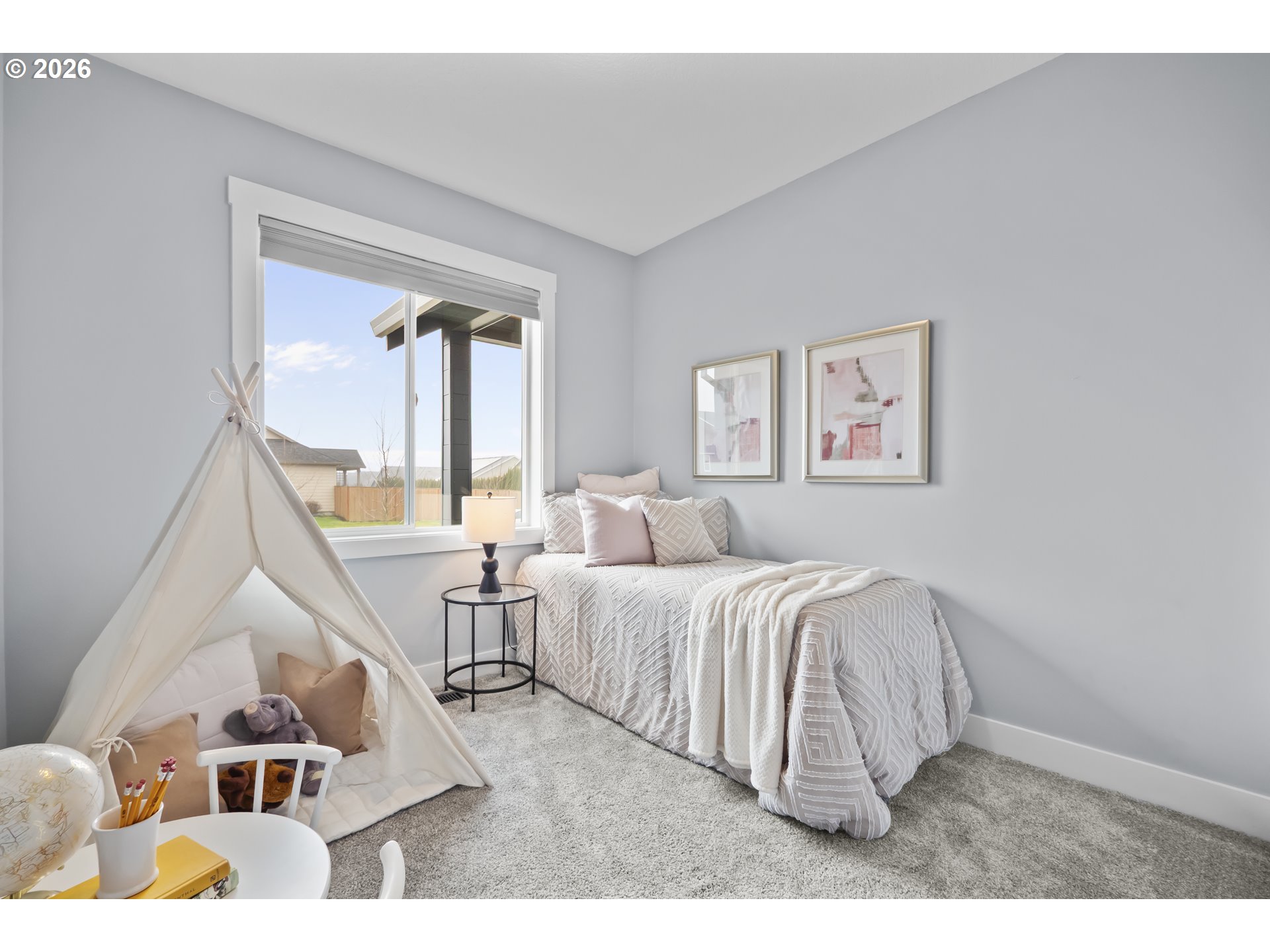 819 Riley Drive Northeast Silverton, OR 97381 - Photo 26 of 38 a living room with a bed furniture and a large window