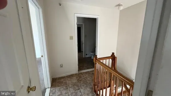 a view of a hallway view with staircase