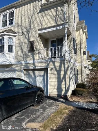a view of a car park in front of house