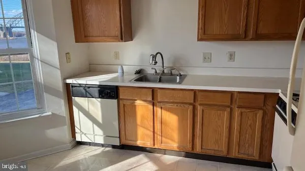 a bathroom with a sink a mirror and cabinets