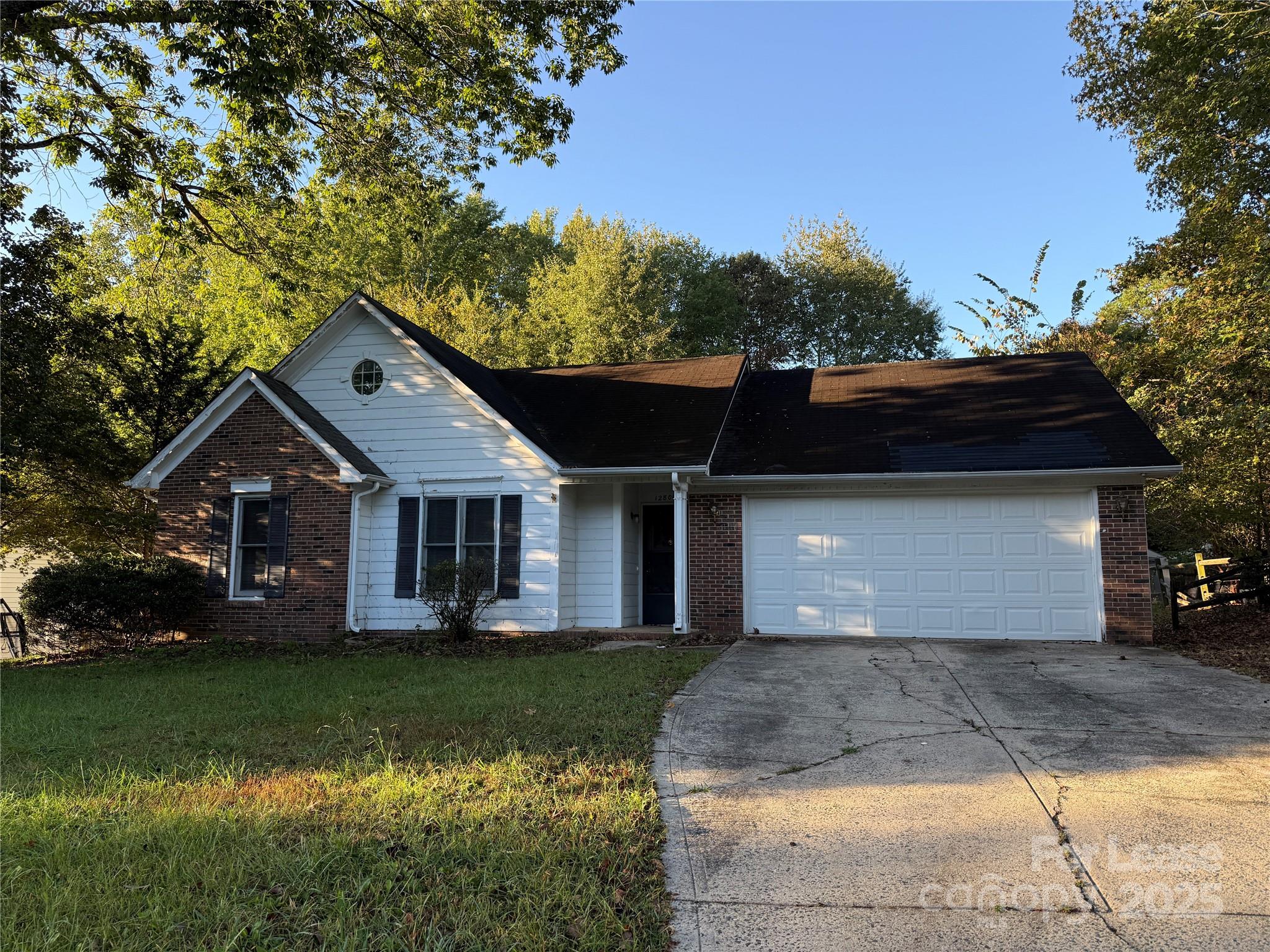 a front view of house with garden