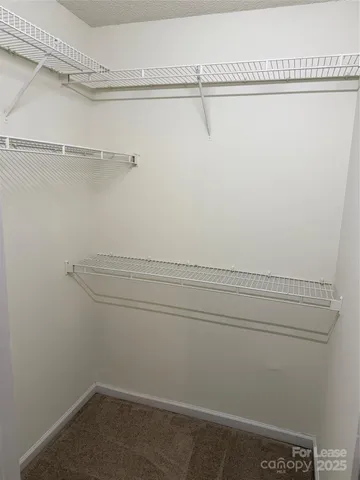 a view of a room with racks on the wall