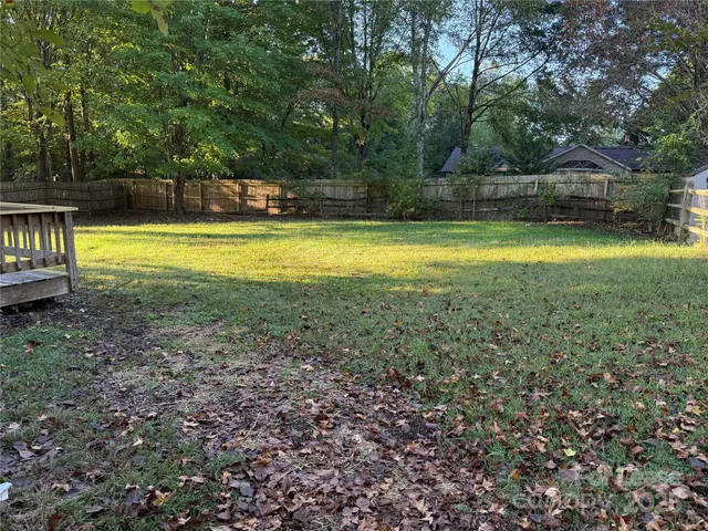 a view of a swimming pool with an outdoor space and seating area