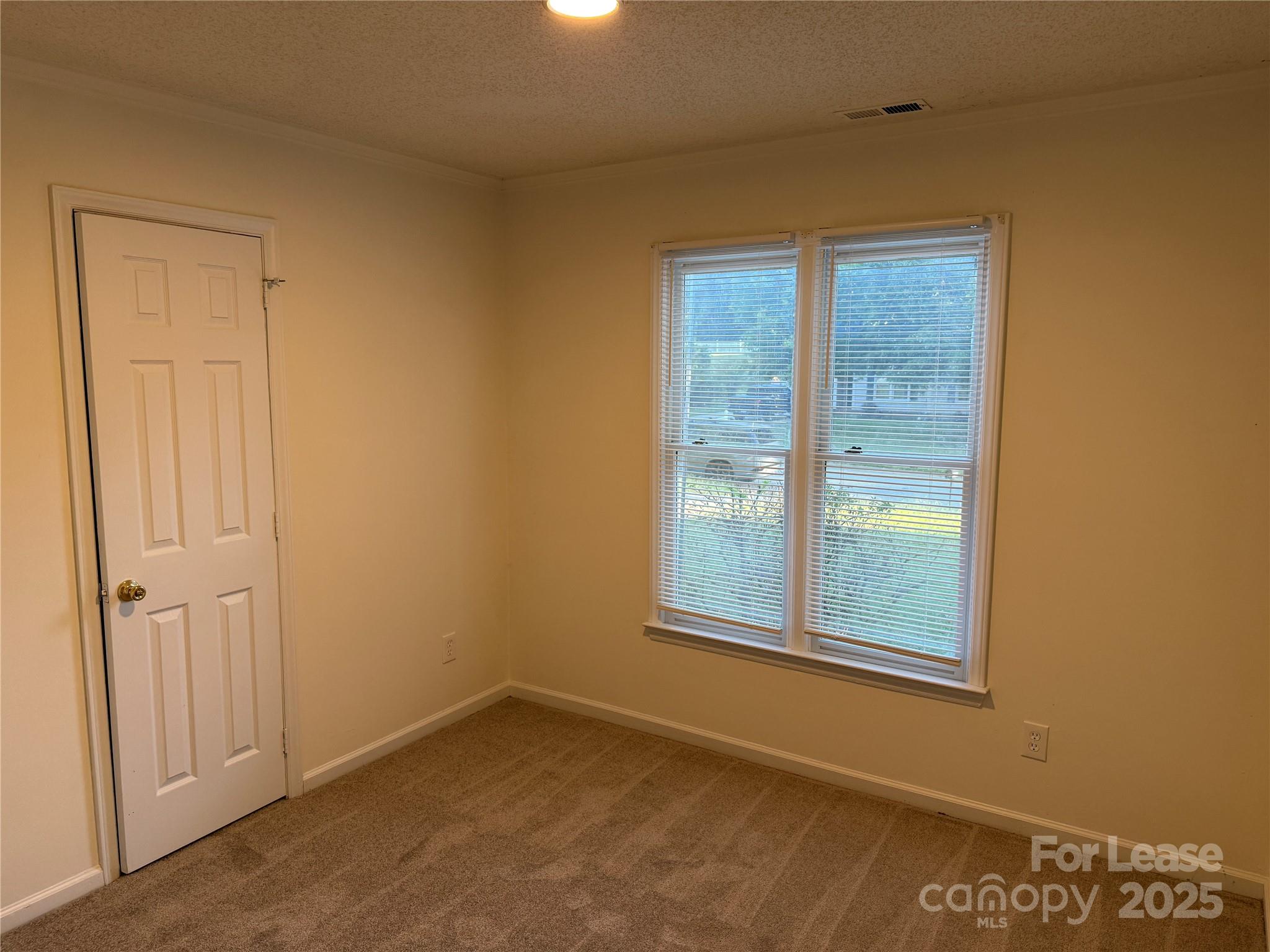 12800 Levins Hall Road Huntersville, NC 28078 - Photo 8 of 16 an empty room with a window