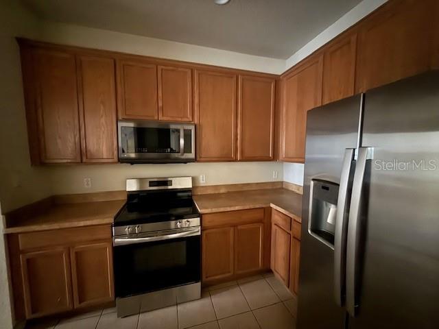 3341 Whitestone Circle, Unit 204 Kissimmee, FL 34741 - Photo 2 of 14 a kitchen with a sink stove and microwave