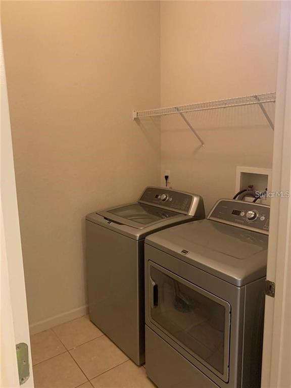 3341 Whitestone Circle, Unit 204 Kissimmee, FL 34741 - Photo 8 of 14 a utility room with dryer and washer