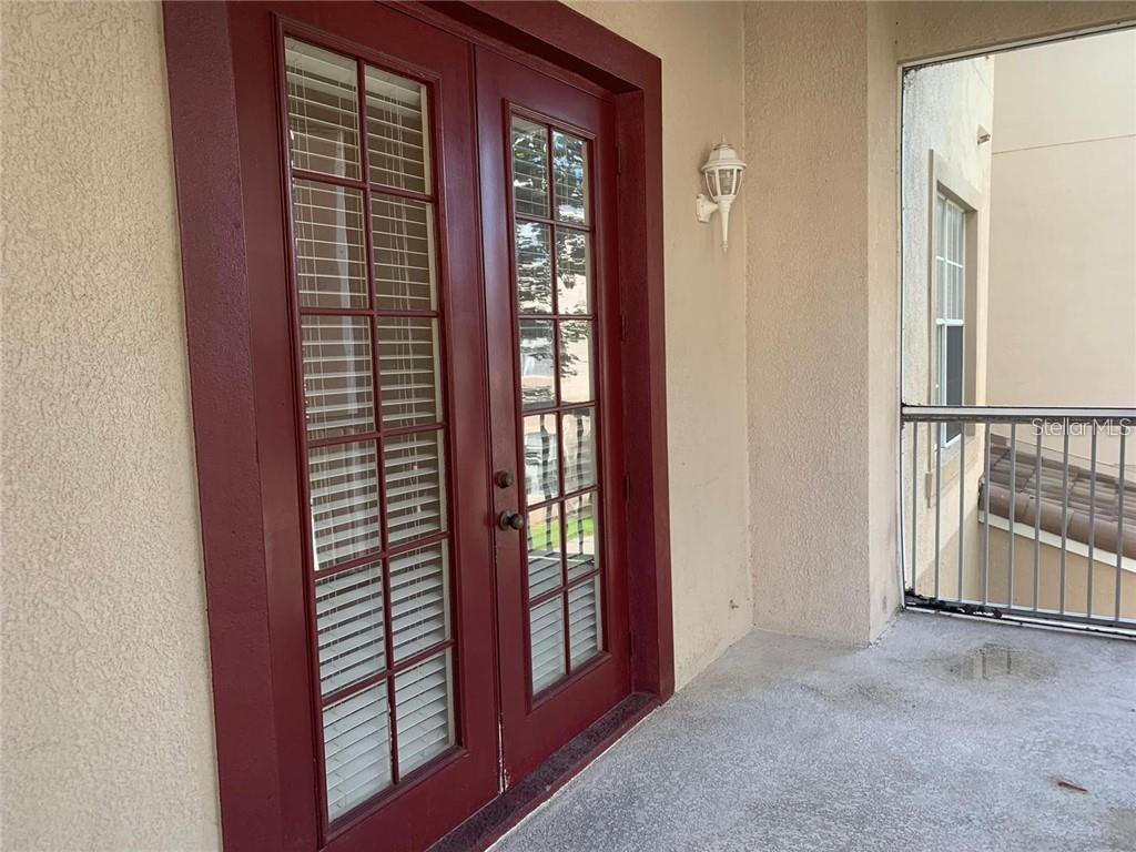 3341 Whitestone Circle, Unit 204 Kissimmee, FL 34741 - Photo 9 of 14 a view of an entryway with wooden floor