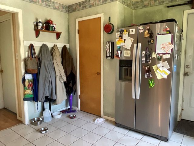 a view of walk in closet with clothes