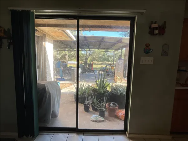 a swimming pool with lots of tress in front of it