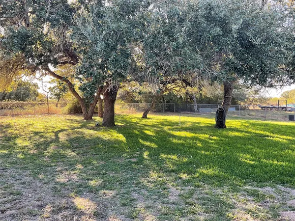 a view of garage with wooden floor