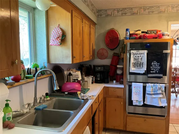 a kitchen with a sink and a stove