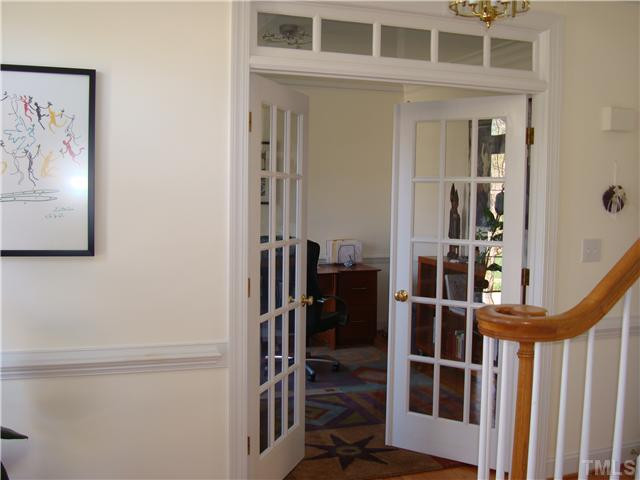 Living room, used an an office, features french doors for quiet and privacy.