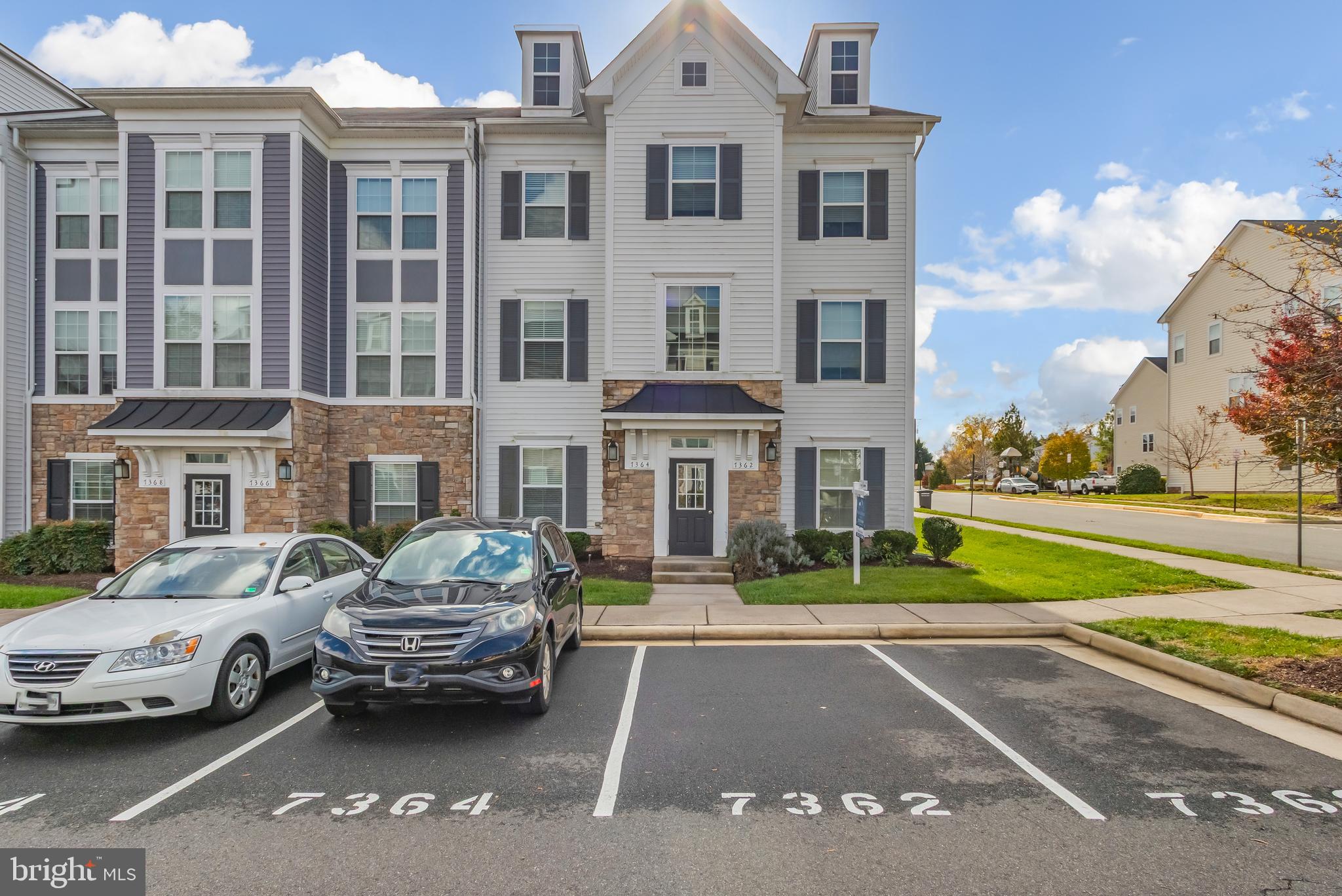 a car parked in front of a brick house