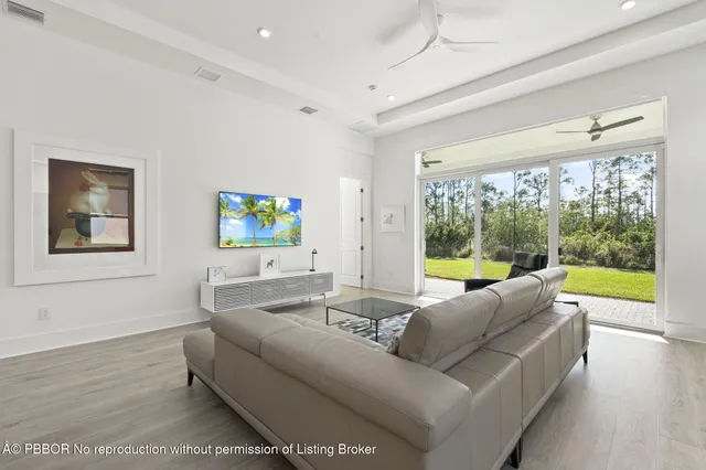 a living room with couch and a large window