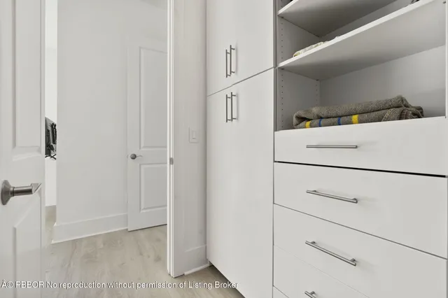 a view of a closet with storage