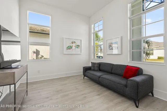 a living room with furniture and a window