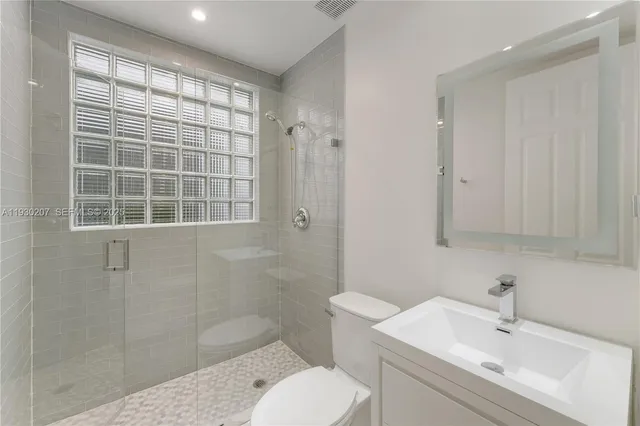 a view of a house with swimming pool in front of house