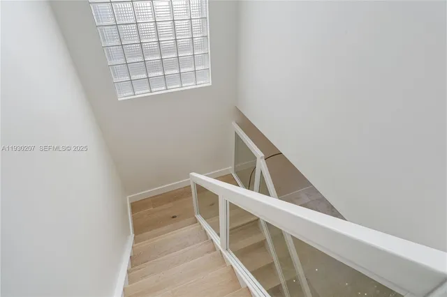 a bathroom with a tub a sink and mirror