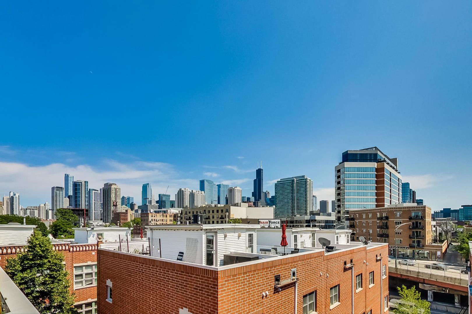 855 West Erie Street, Unit 126 Chicago, IL 60642 - Photo 17 of 24 a view of city with tall buildings