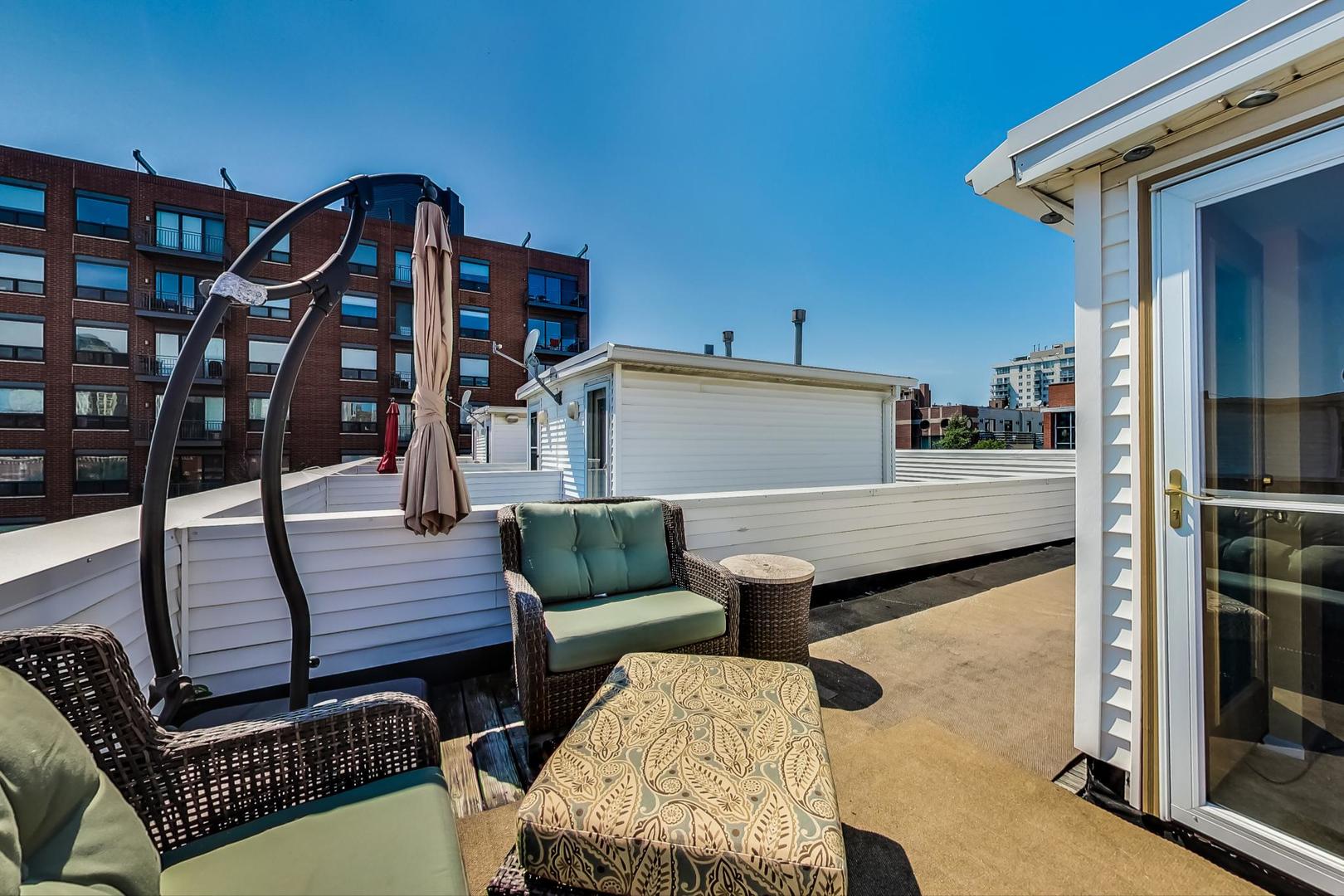 855 West Erie Street, Unit 126 Chicago, IL 60642 - Photo 19 of 24 a view of a balcony with furniture