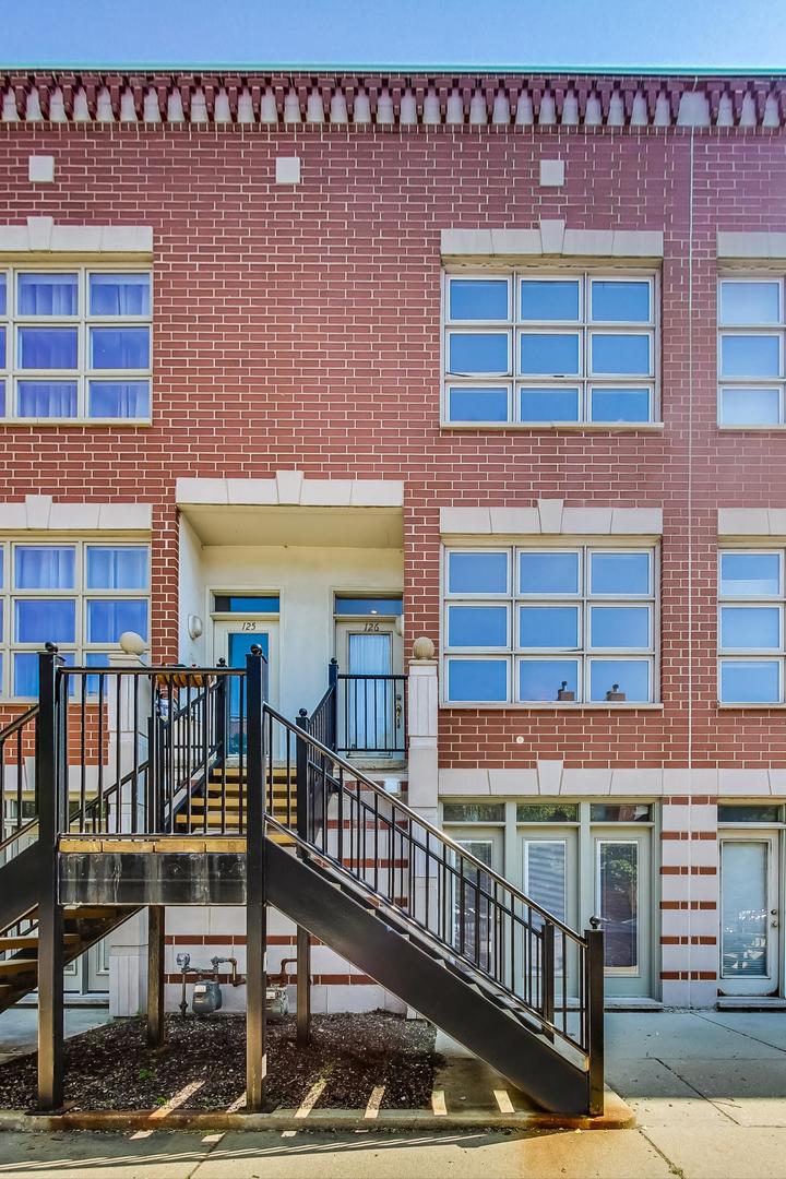 855 West Erie Street, Unit 126 Chicago, IL 60642 - Photo 24 of 24 a front view of a building with glass windows