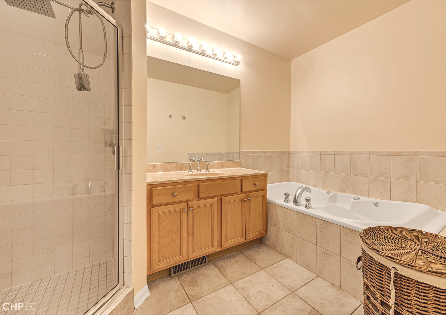 855 West Erie Street, Unit 126 Chicago, IL 60642 - Photo 9 of 24 a bathroom with a sink a bathtub and a shower