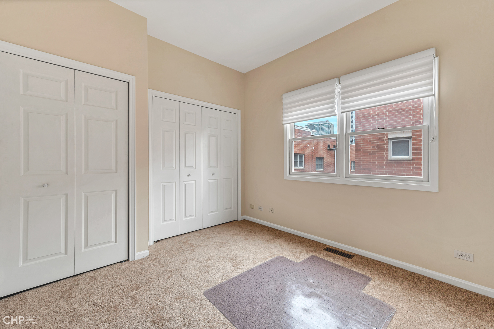 855 West Erie Street, Unit 126 Chicago, IL 60642 - Photo 10 of 24 an empty room with windows