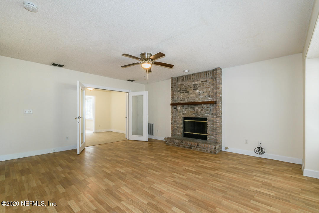 4449 Tumbleweed Road Middleburg, FL 32068 - Photo 4 of 21 Living Room + Fireplace
