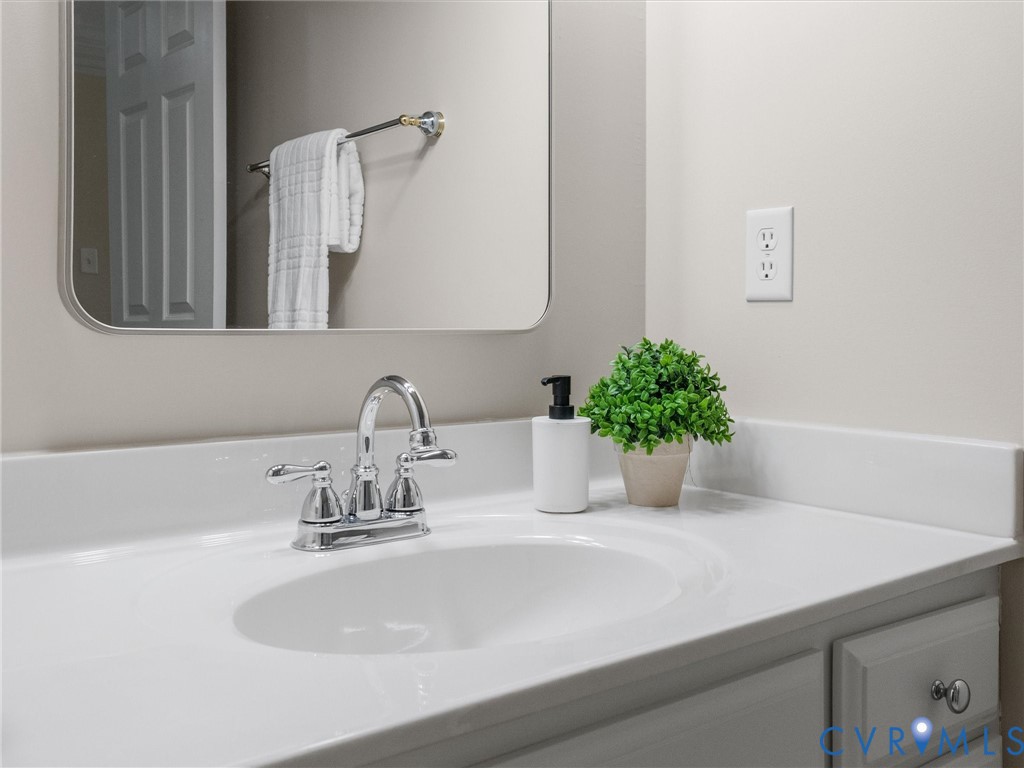 14335 Lander Road Midlothian, VA 23113 - Photo 53 of 70 a bathroom with a sink and a mirror