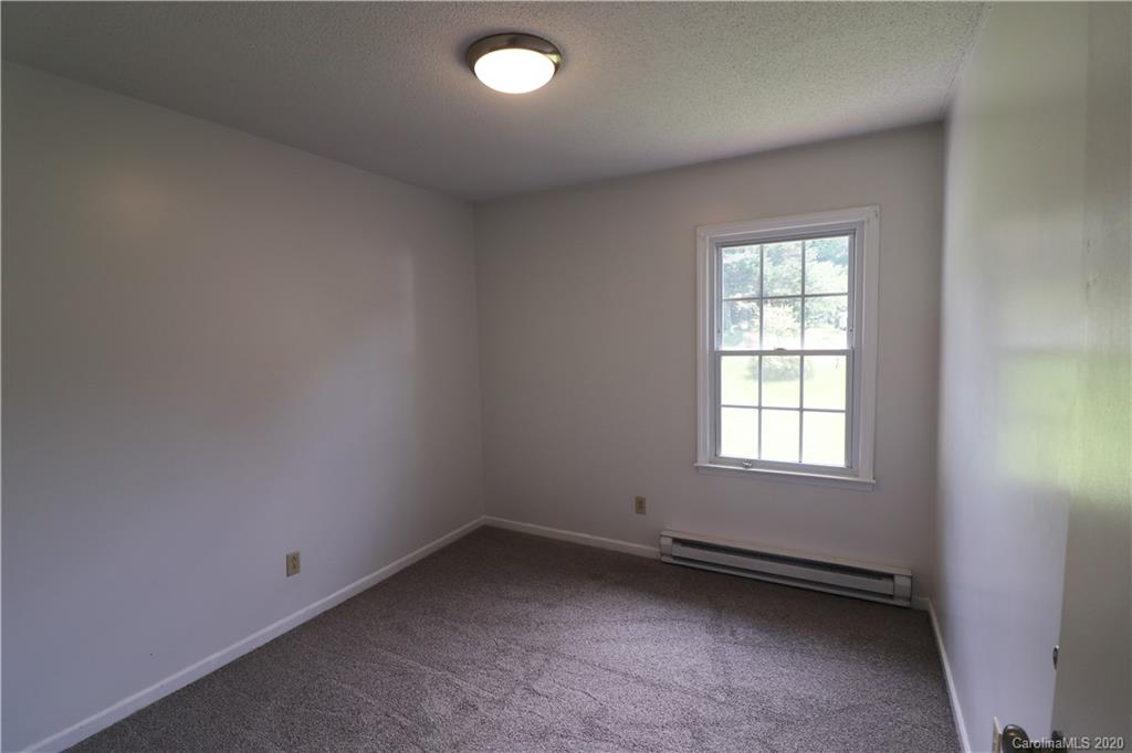 548 Heatherton Lane Rural Hall, NC 27045 - Photo 14 of 27 an empty room with a window