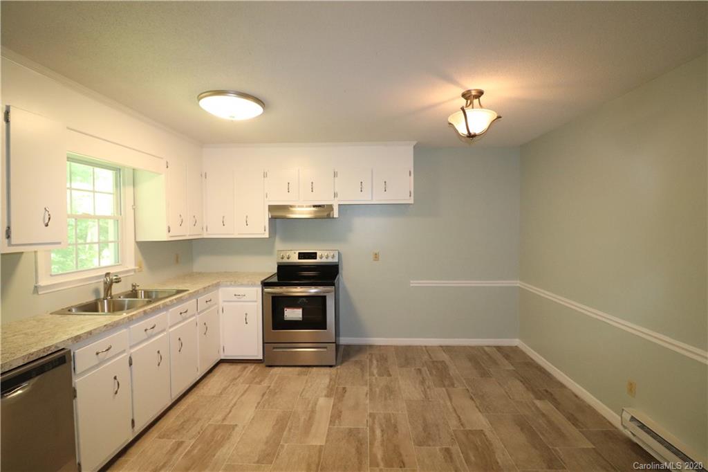 548 Heatherton Lane Rural Hall, NC 27045 - Photo 8 of 27 a view of a kitchen with electric appliances