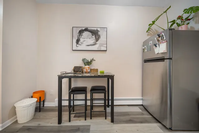 a dining room with a table and chairs
