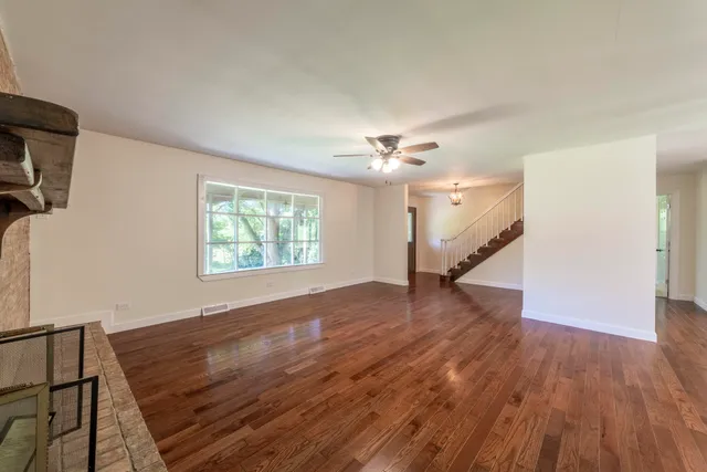 a kitchen with stainless steel appliances kitchen island a stove and a microwave