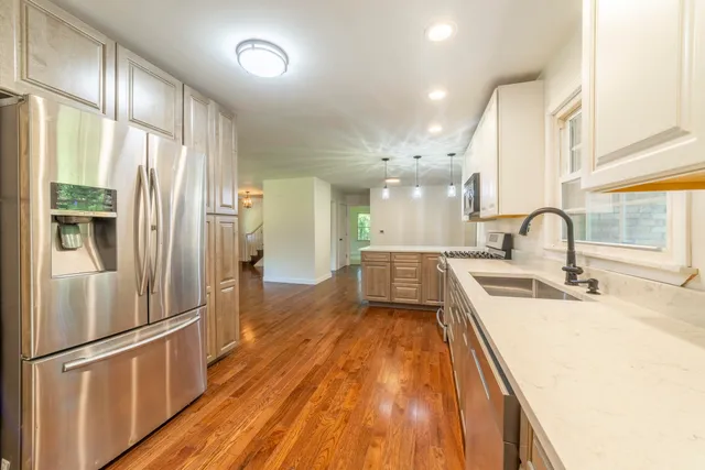 a kitchen that has a sink and a window