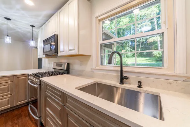 an empty room with windows and closet