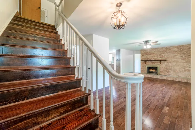 a bathroom with a sink vanity mirror and toilet