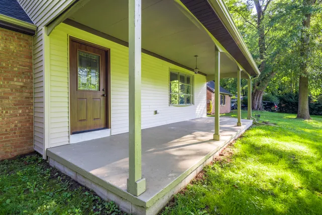 a view of a house with a door and wooden floor