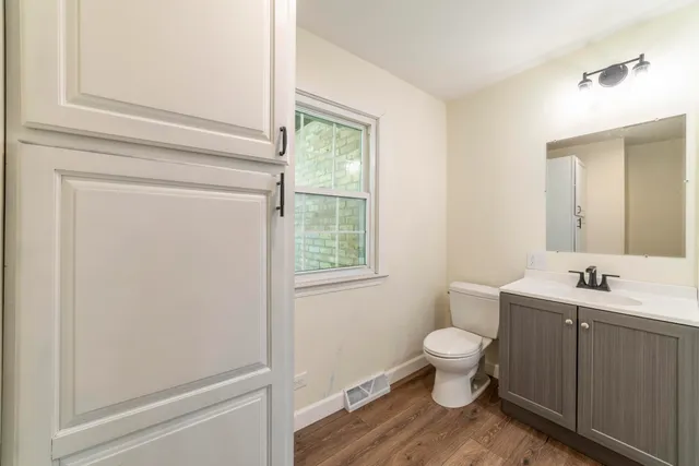 a front view of house with a garden