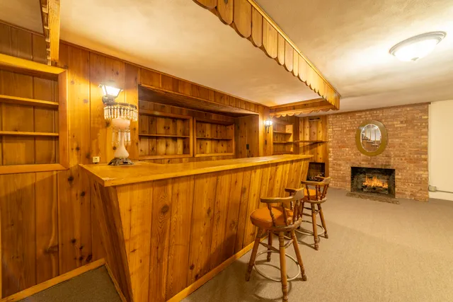 a view of yard with swimming pool and green space