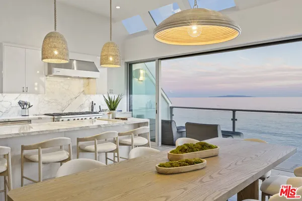 a kitchen with a table and chairs