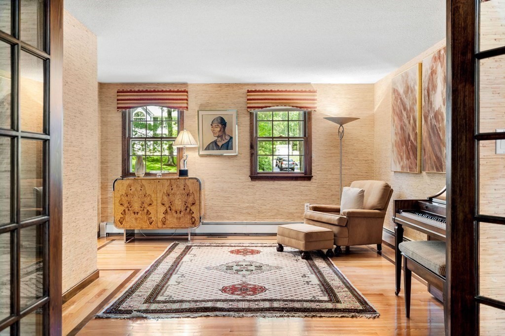 7 Ridge Hill Way Andover, MA 01810 - Photo 12 of 42 a living room with furniture and a window