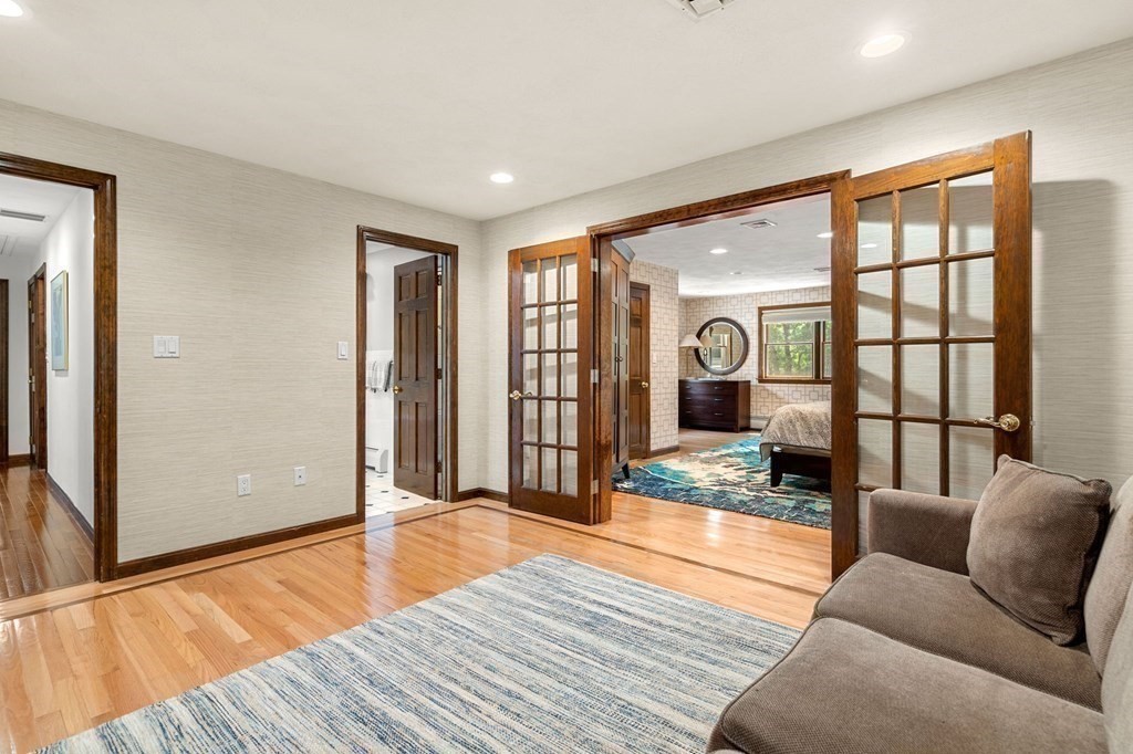 7 Ridge Hill Way Andover, MA 01810 - Photo 25 of 42 a bedroom with a bed couch and view of living room