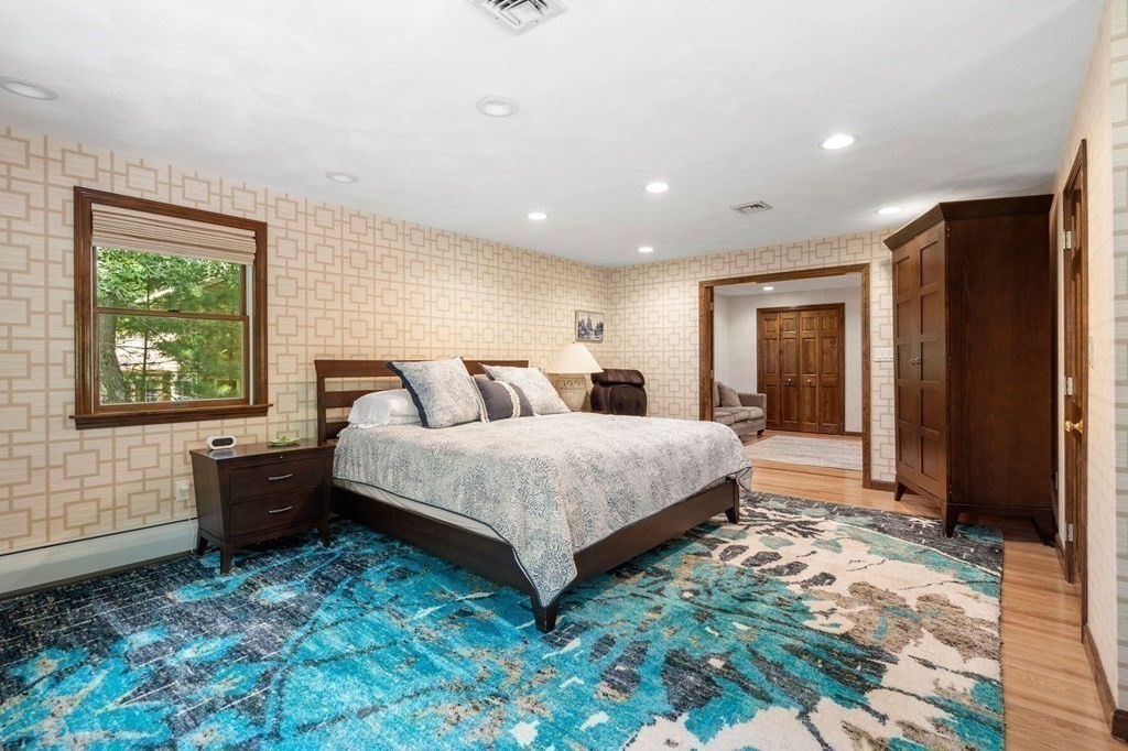 7 Ridge Hill Way Andover, MA 01810 - Photo 27 of 42 a spacious bedroom with a large bed and a window