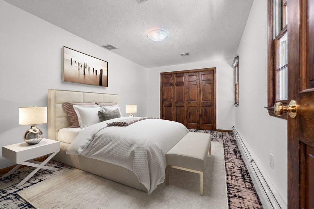 7 Ridge Hill Way Andover, MA 01810 - Photo 32 of 42 a bedroom with a bed and a table