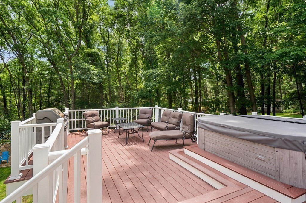 7 Ridge Hill Way Andover, MA 01810 - Photo 37 of 42 a view of a deck with couches wooden floor and fence
