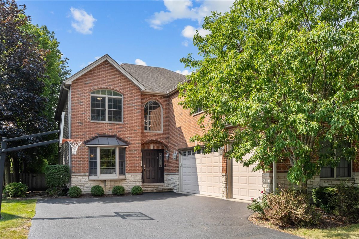 a view of house with yard