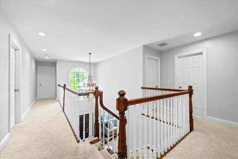 a view of a hallway with a livingroom